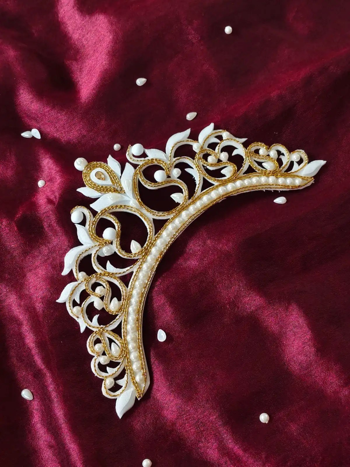 White and gold pearl mukut on silk